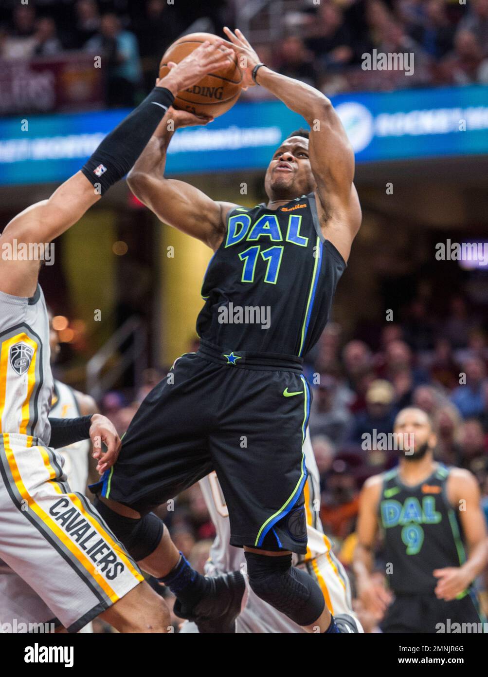 Dallas Mavericks' Yogi Ferrell (11) shoots over Cleveland Cavaliers ...