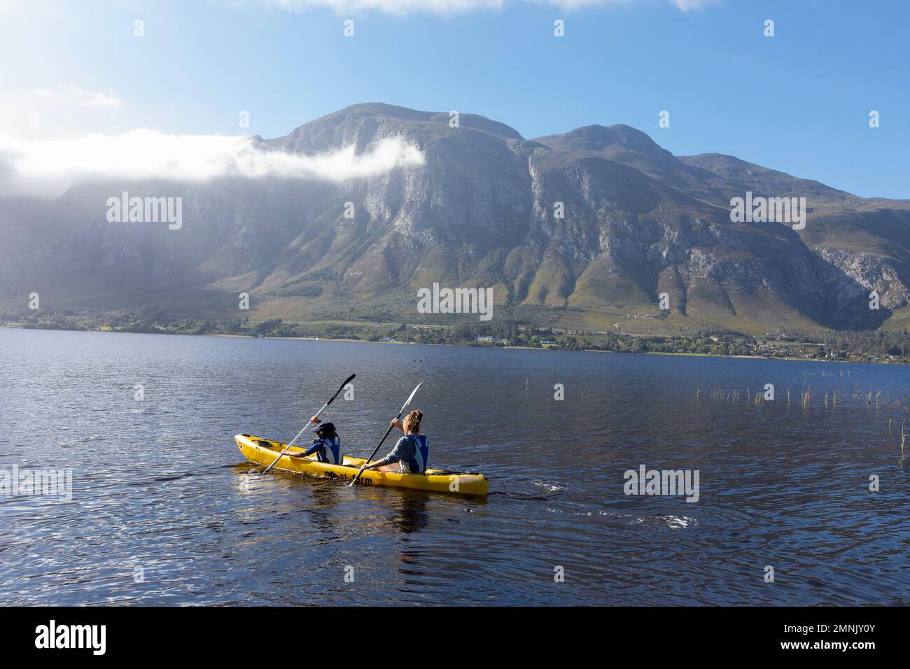 South Africa, Stanford, Boy and teenage girl (10-11, 16-17) kayaking in lagoon Stock Photo