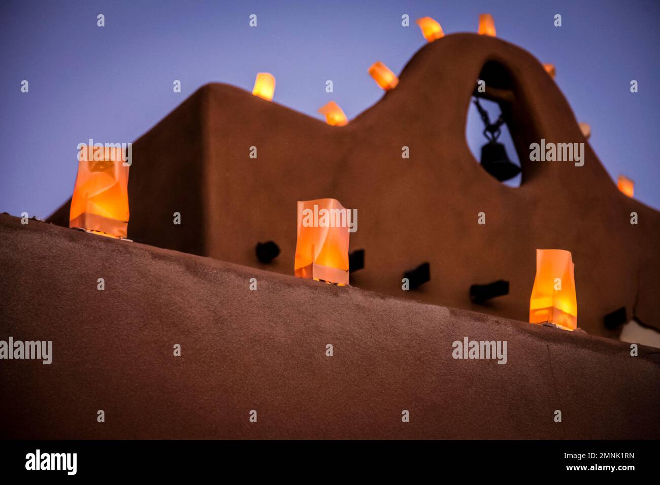 USA, New Mexico, Santa Fe, Traditional farolitos lanterns on adobe building Stock Photo