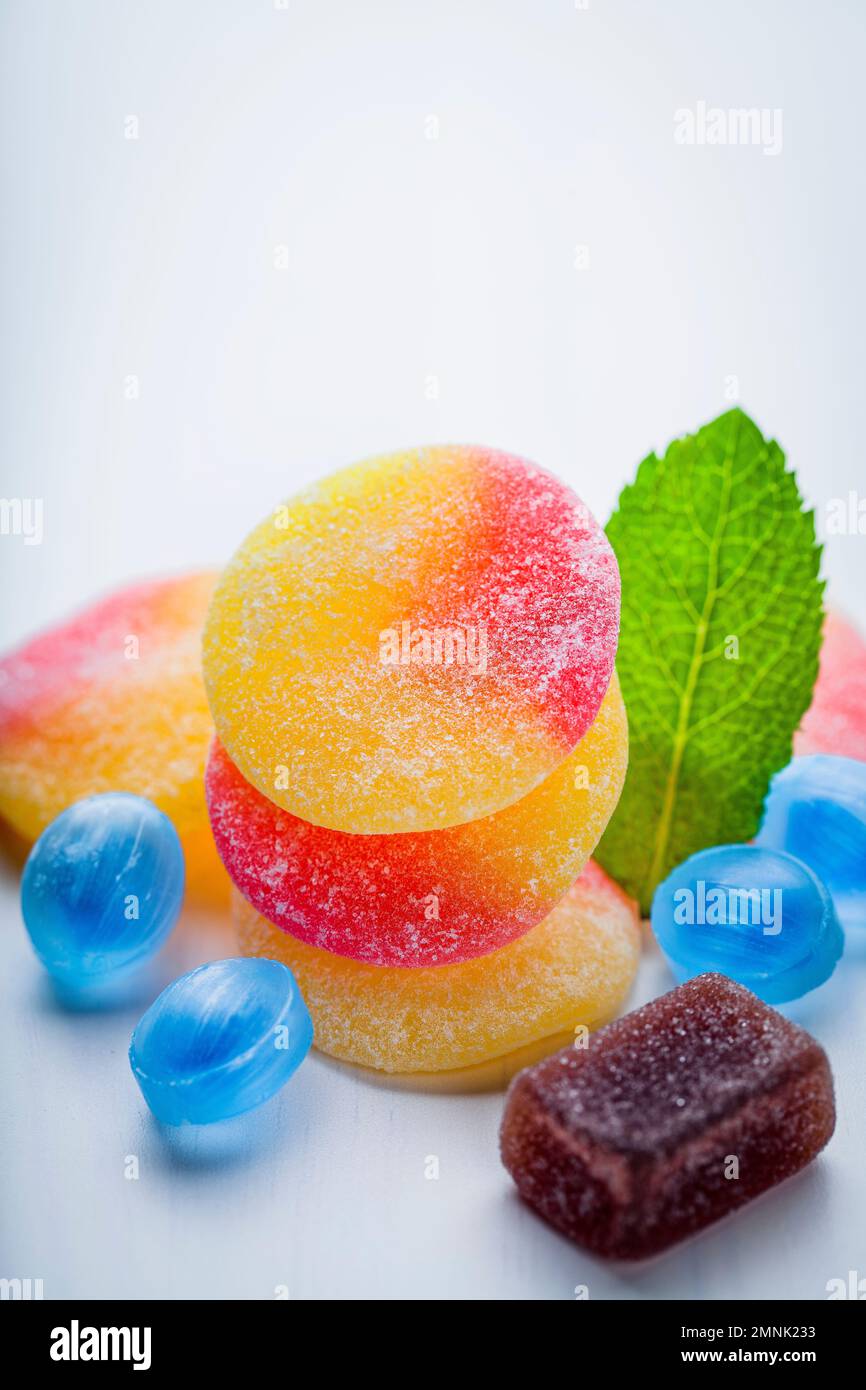 sweet colorful fruit sugar gummy candies on top Stock Photo
