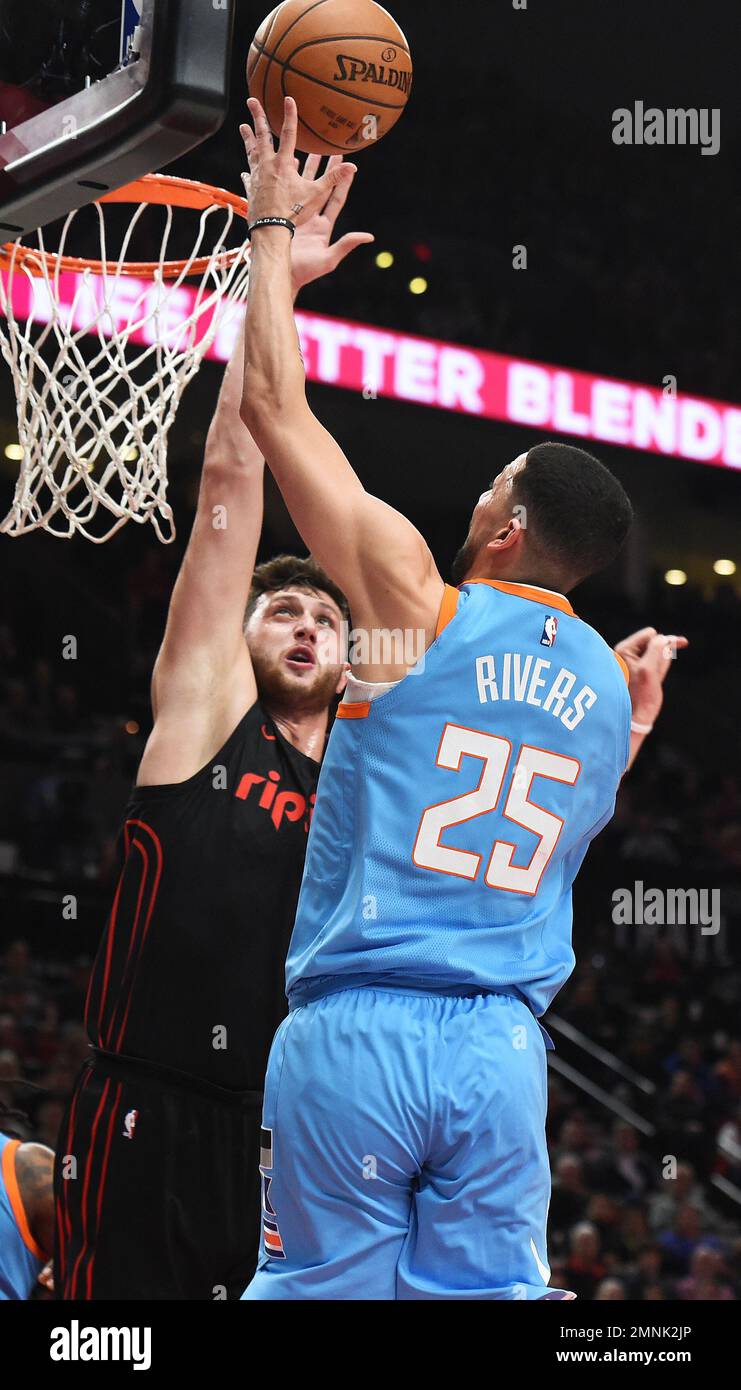Los Angeles Clippers guard Austin Rivers, right, shoots the ball over