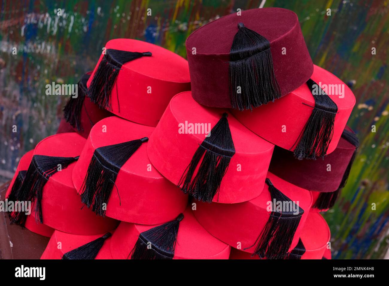 Traditional red Fez hats piled up for sale Stock Photo Alamy