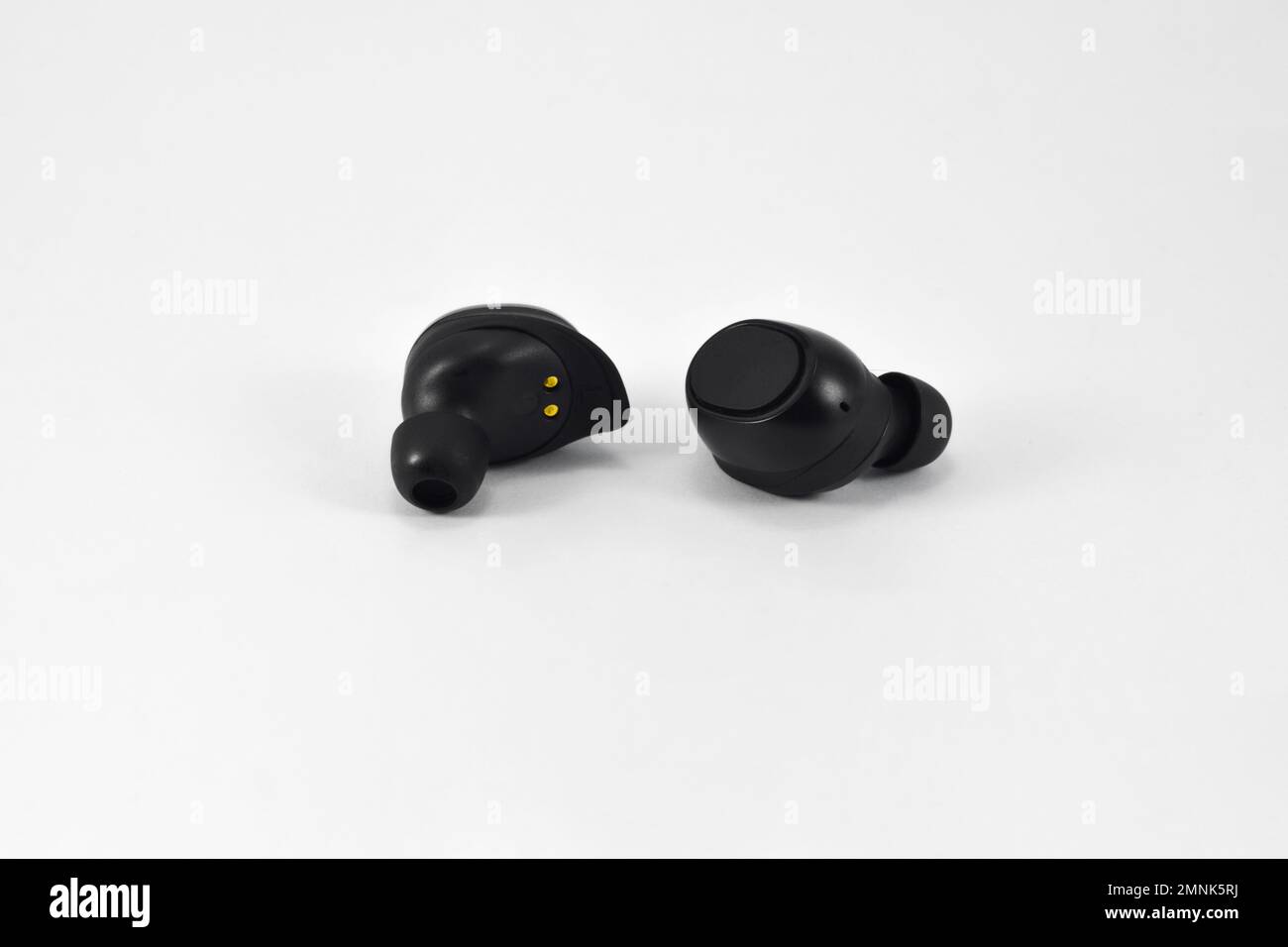 True Wireless Earphone bluetooth voice control isolated on white background. Stock Photo
