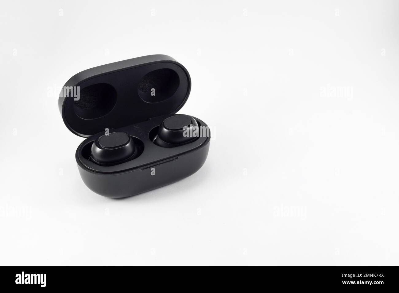 Wireless earphone bluetooth voice control with charger isolated on