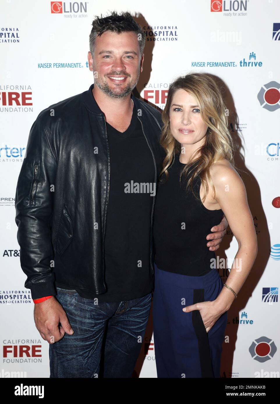 Tom Welling, left, and Jessica Rose Lee arrives at the 5th Annual