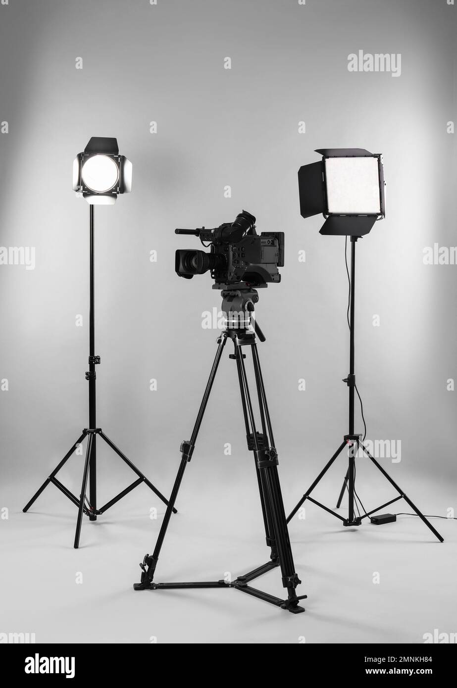 Professional video camera and lighting equipment on white background Stock Photo Alamy