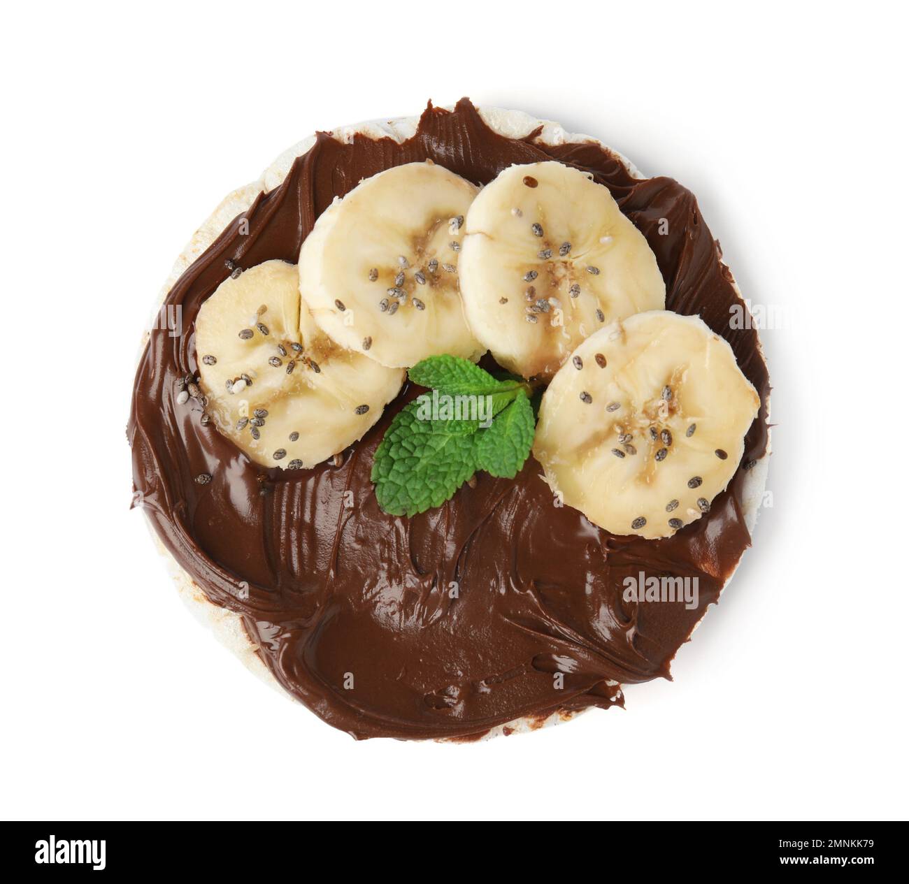 Puffed rice cake with chocolate spread, banana and mint isolated on