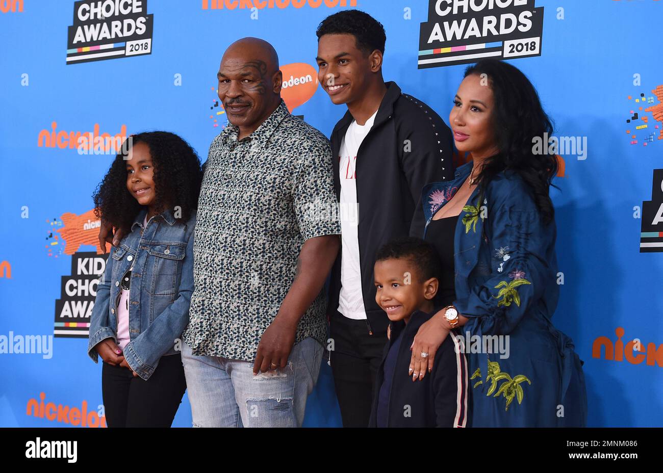 Mike Tyson, second left, and Lakiha Spicer, right, and from left, Milan