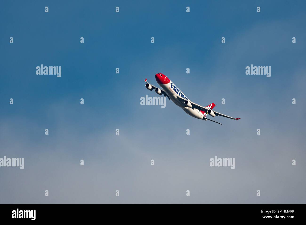 Zurich, Switzerland, January 19, 2023 Edelweiss Airbus A340-313X overhead in the blue sky Stock Photo