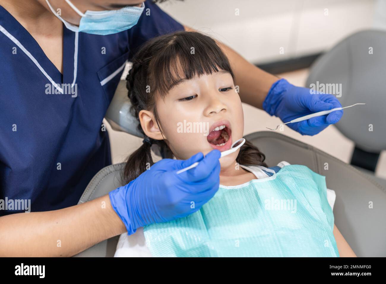 The dentist for the little girl Stock Photo - Alamy