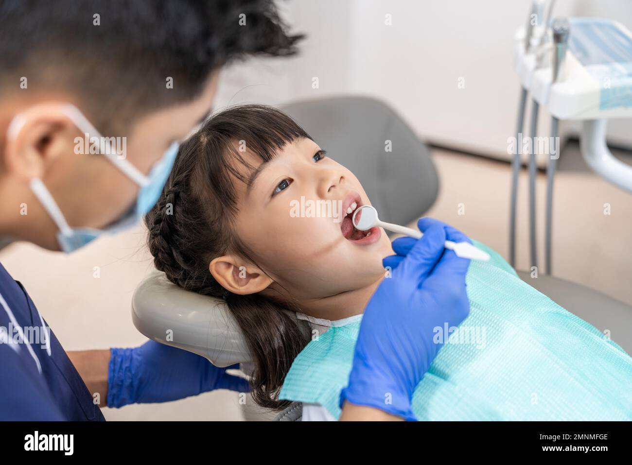 The dentist for the little girl Stock Photo - Alamy