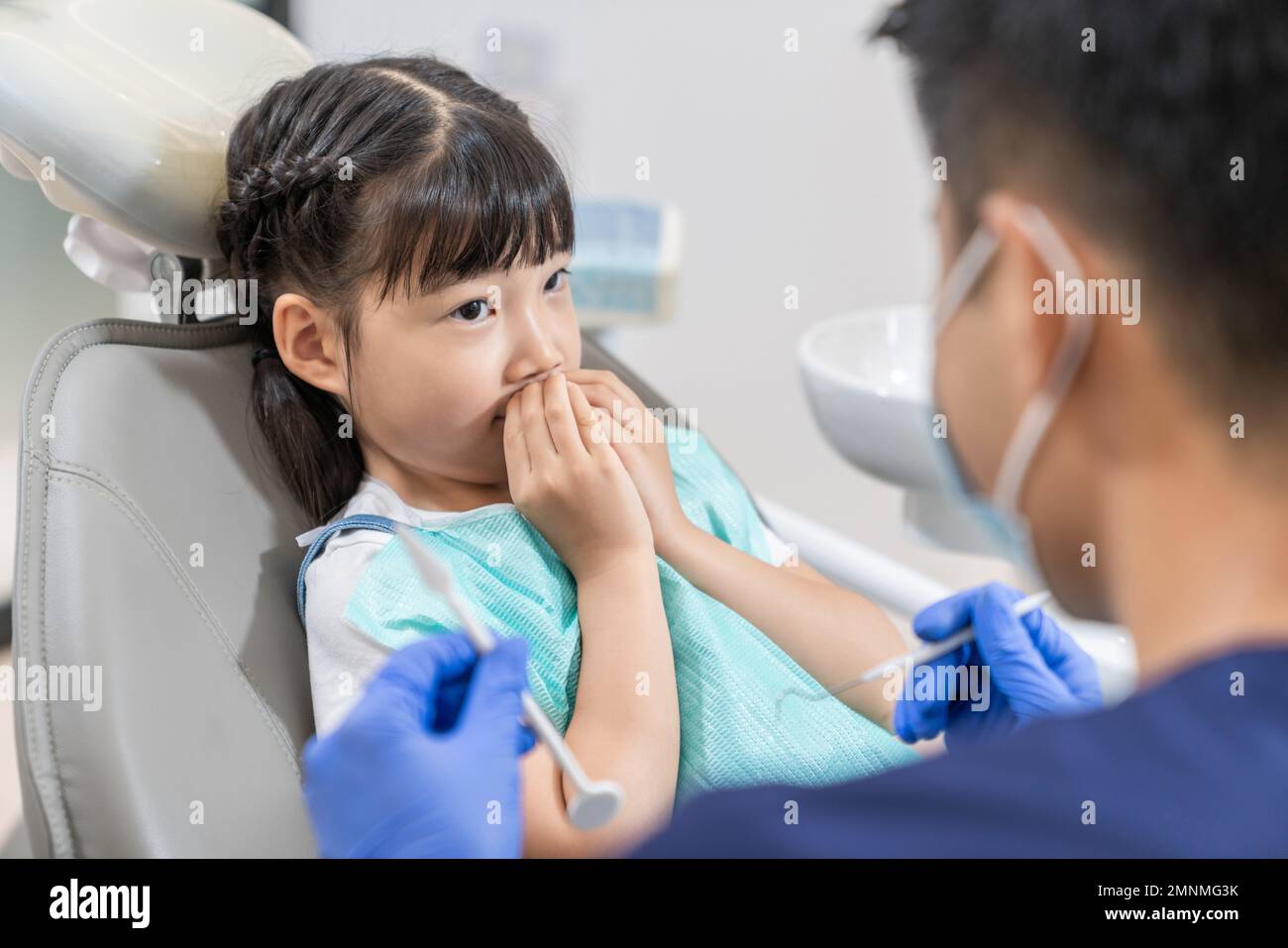 The dentist for the little girl Stock Photo - Alamy