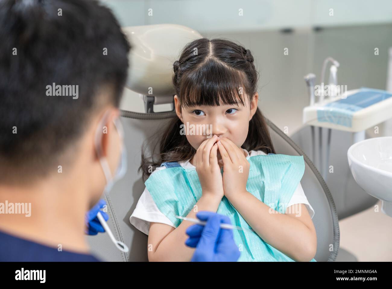 The dentist for the little girl Stock Photo - Alamy