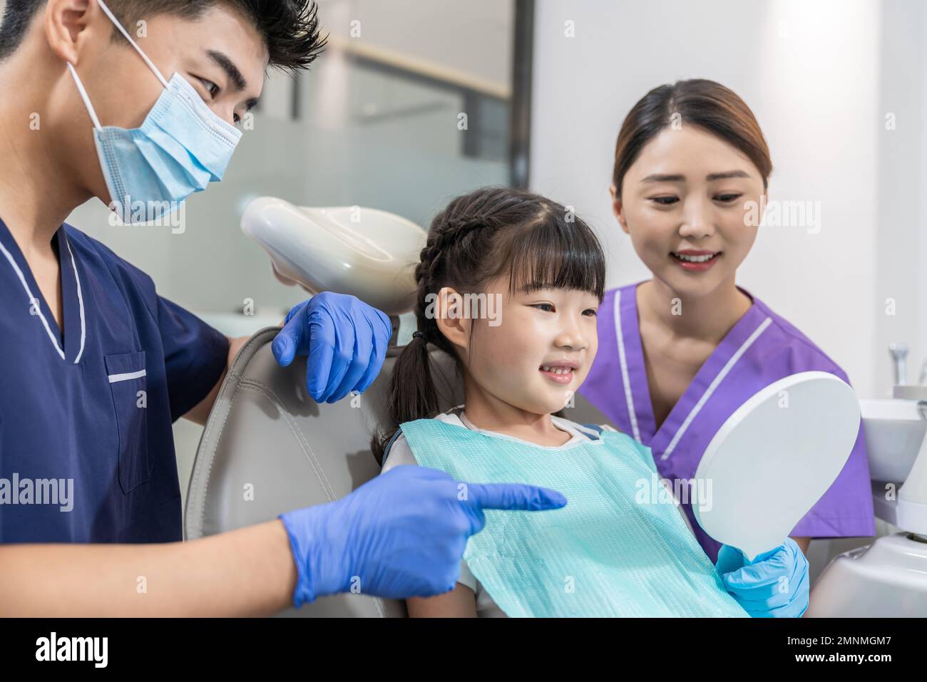The dentist for the little girl Stock Photo - Alamy