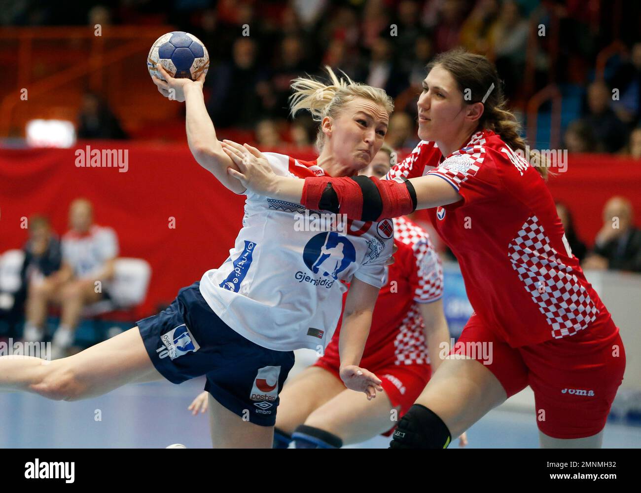 Norway's Stine Bredal Oftedal, left, makes a shot during the qualifying  handball match for the European Championships between Croatia and Norway,  in Zagreb, Croatia, Wednesday, March 21, 2018. (AP Photo/Darko Bandic Stock