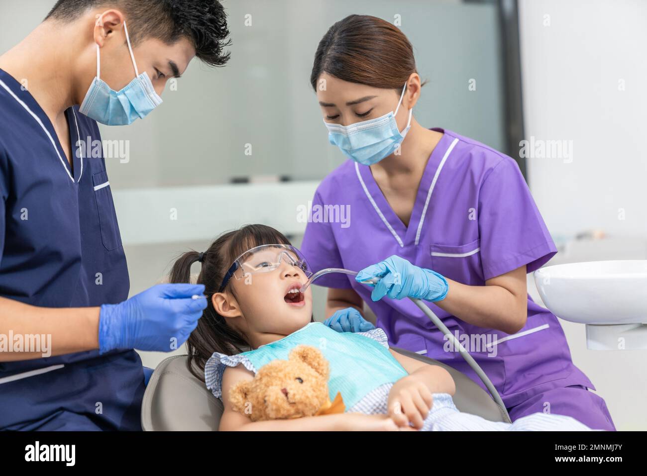 The dentist for the little girl Stock Photo - Alamy