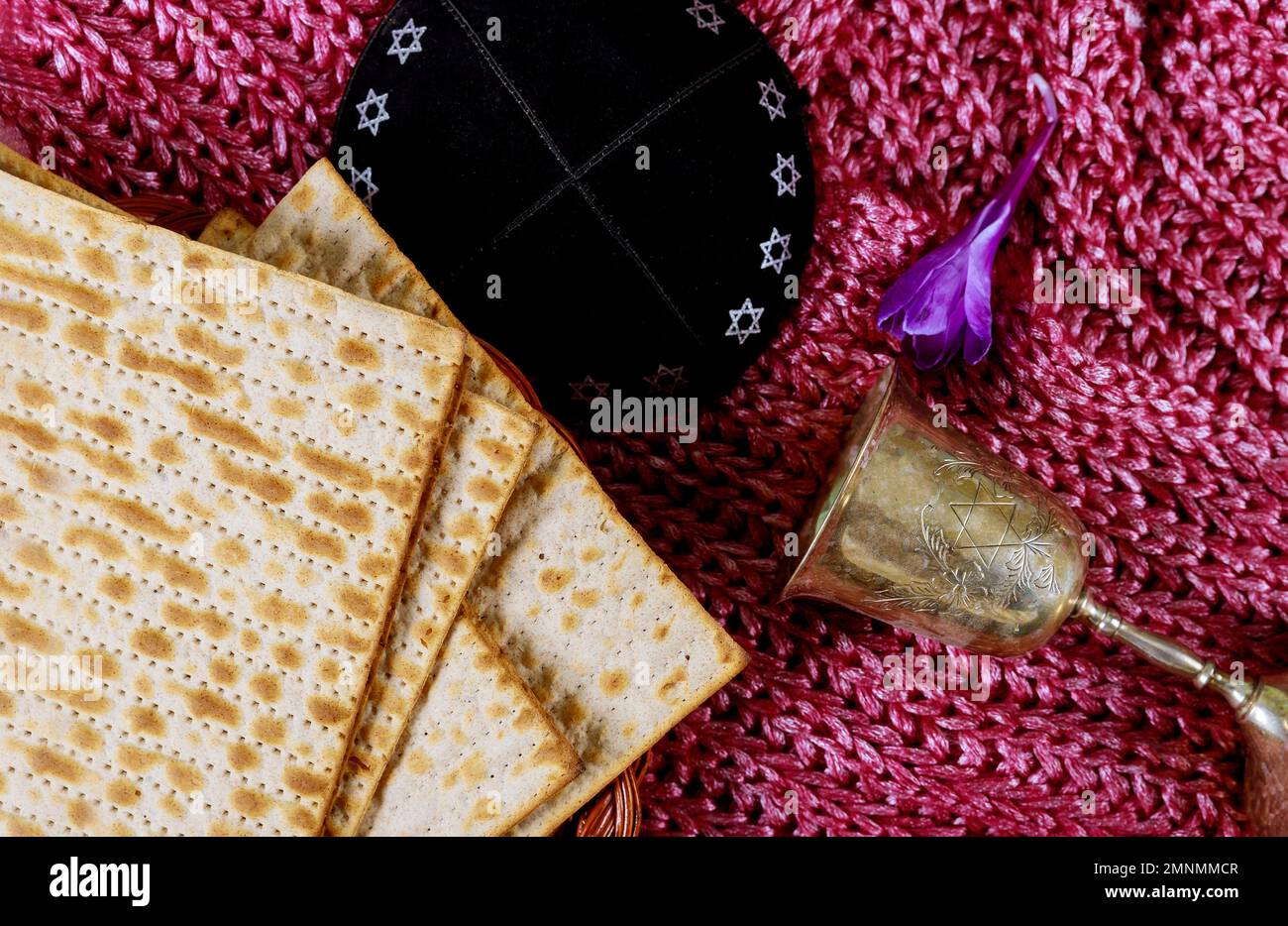 During Jewish holiday of Pesach, kosher kiddush wine unleavened bread matzah is Passover celebration Stock Photo