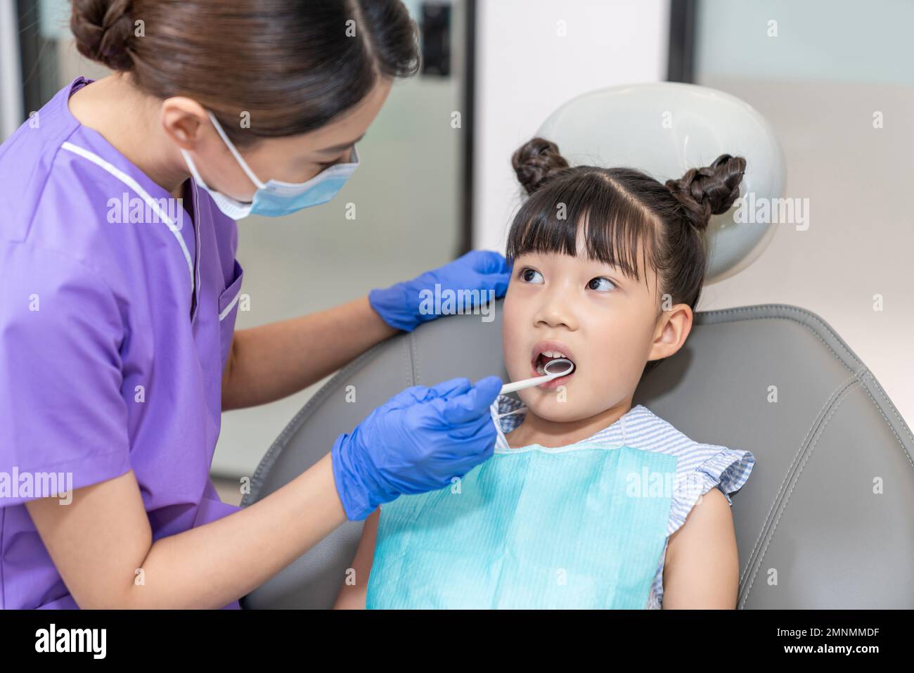 The dentist for the little girl Stock Photo - Alamy