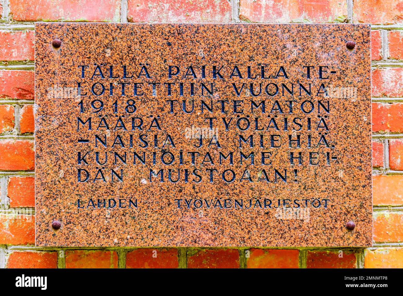 Red granite Memorial plaque on the wall of Place of execution from Civil war  of Finland in 1918 in Lahti Stock Photo