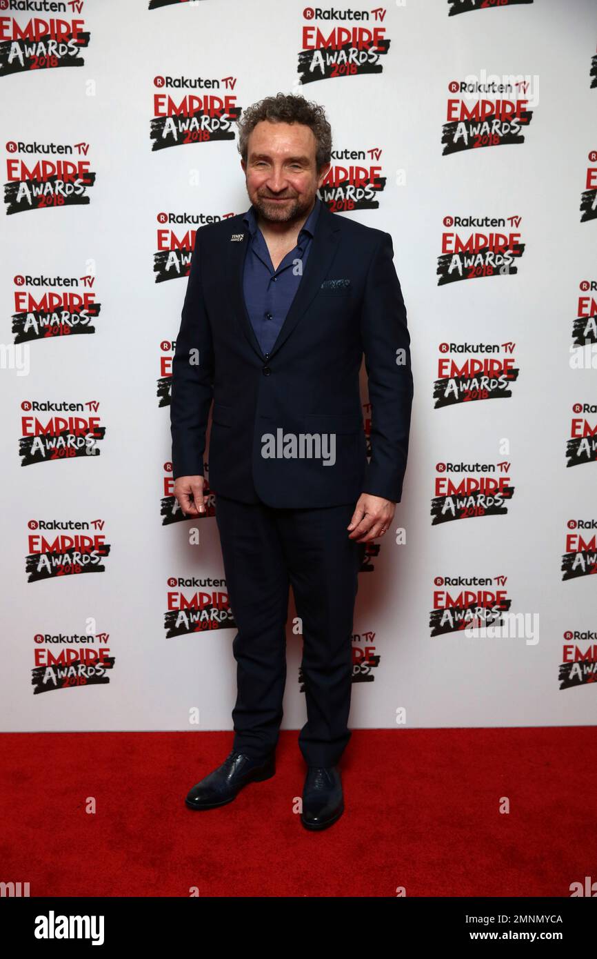 Actor Eddie Marsan poses for photographers on arrival at the Empire