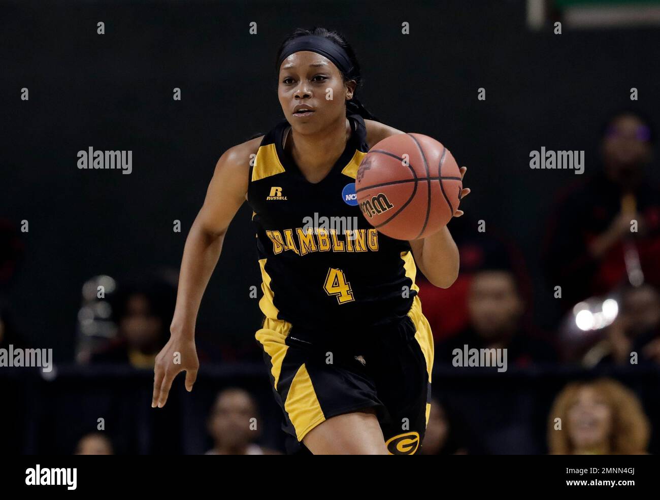 Grambling State guard Monisha Neal (4) advances the ball up court