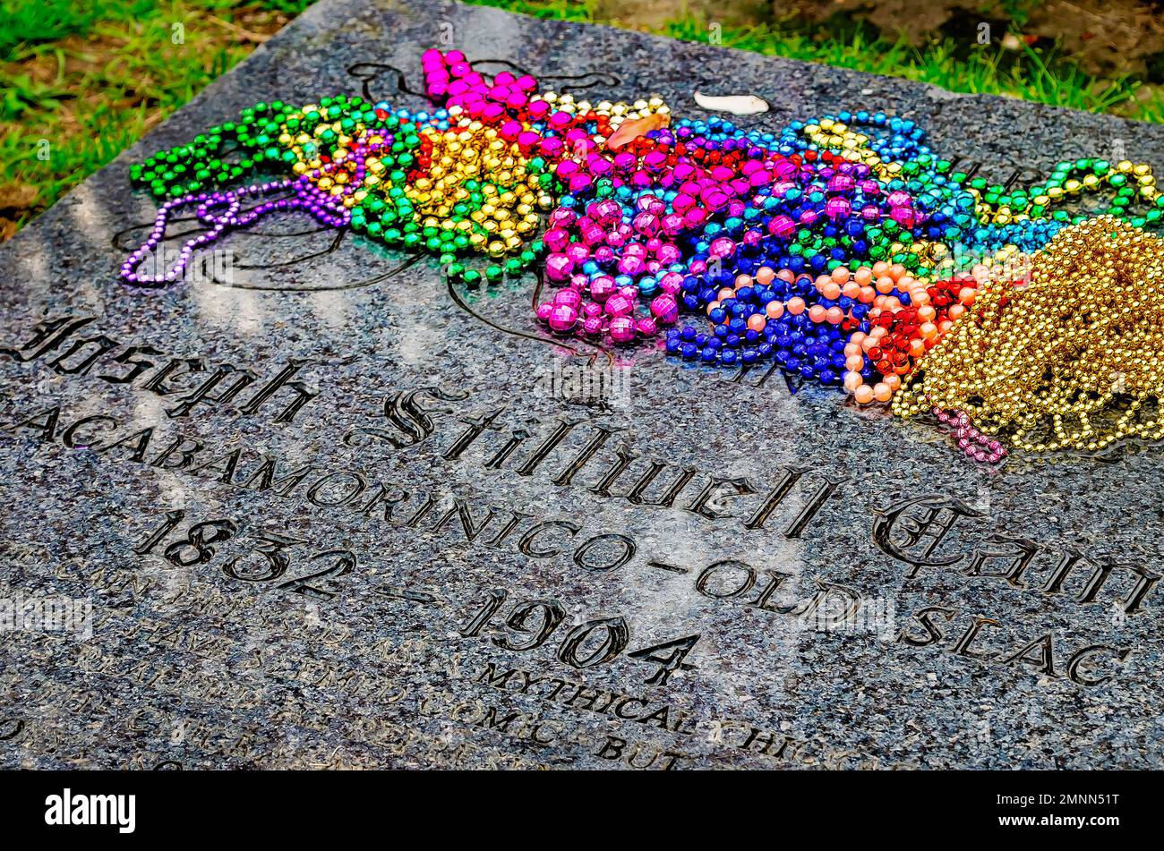 Mardi Gras beads are strewn across Joe Cain’s grave in Church Street Graveyard, Jan. 30, 2023, in Mobile, Alabama. Stock Photo