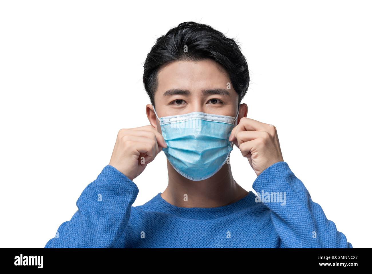 Young men wearing surgical masks Stock Photo Alamy