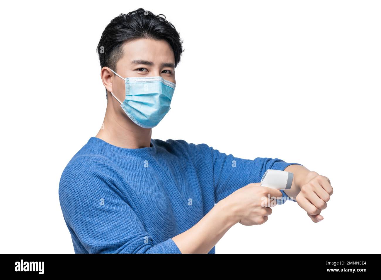 The young man holding a surgical masks temperature measurement Stock ...
