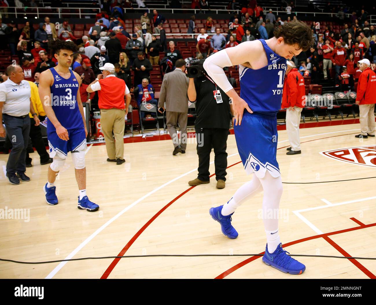 BYU's Payton Dastrup, right, and Elijah Bryant (3) walk off the court