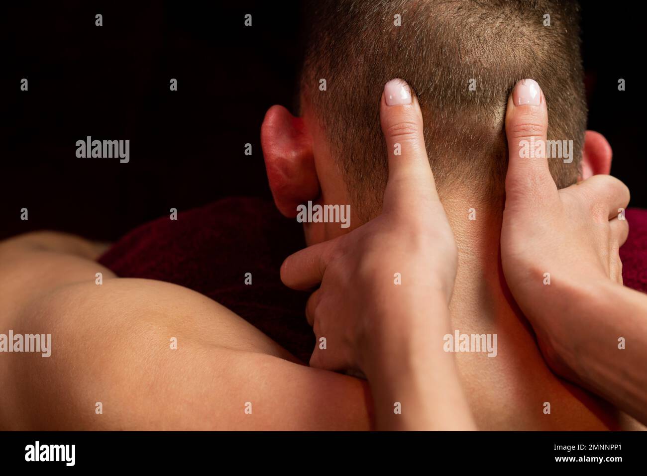 relaxing neck massage in the massage parlor. Stock Photo