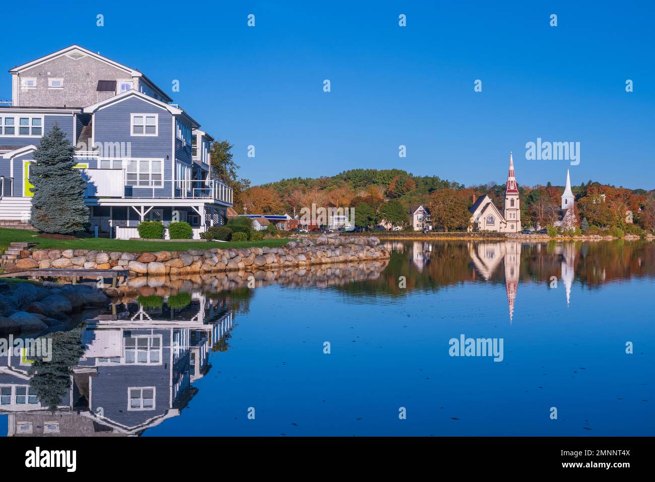 Reflections Of Churches With Fall Foliage Color In Mahone Bay, Nova 