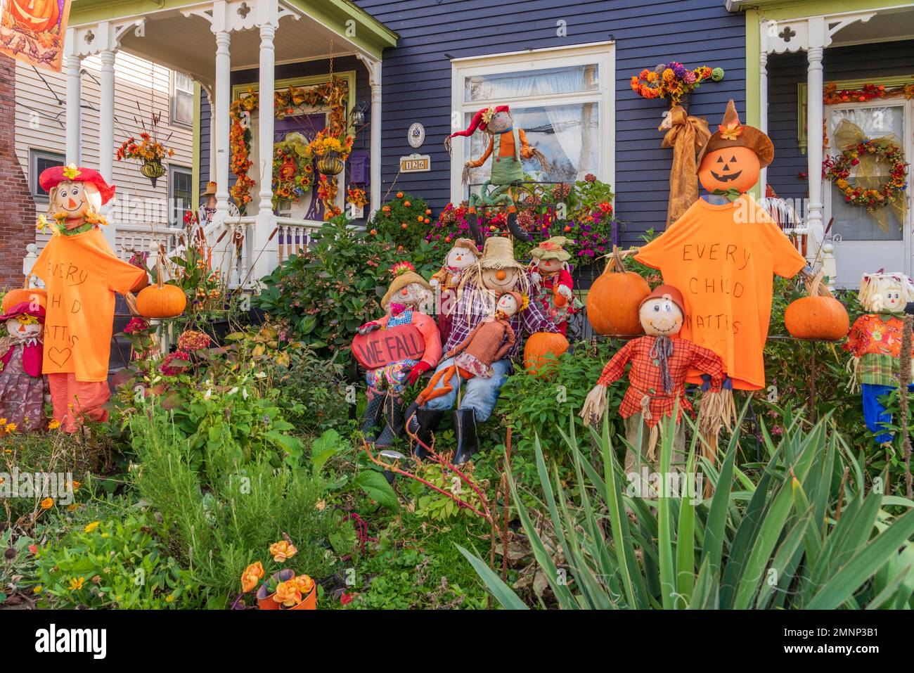 A pumpkin and scarecrow display in the front yard of a home in Truro, Nova Scotia, Canada. Stock Photo