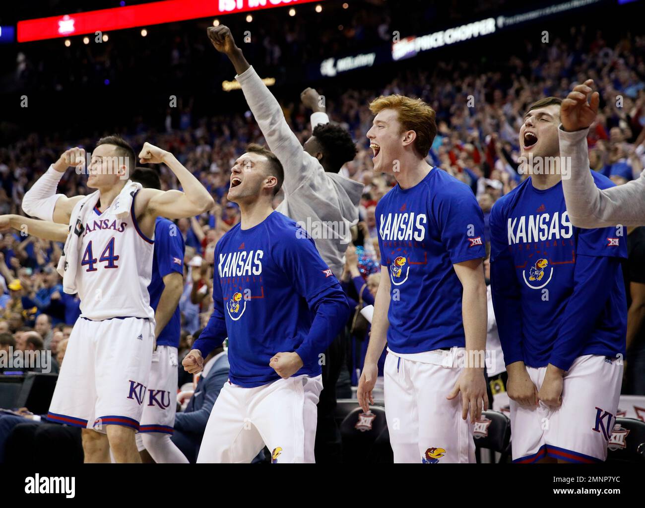 Kansas players celebrate during the second half of the NCAA college