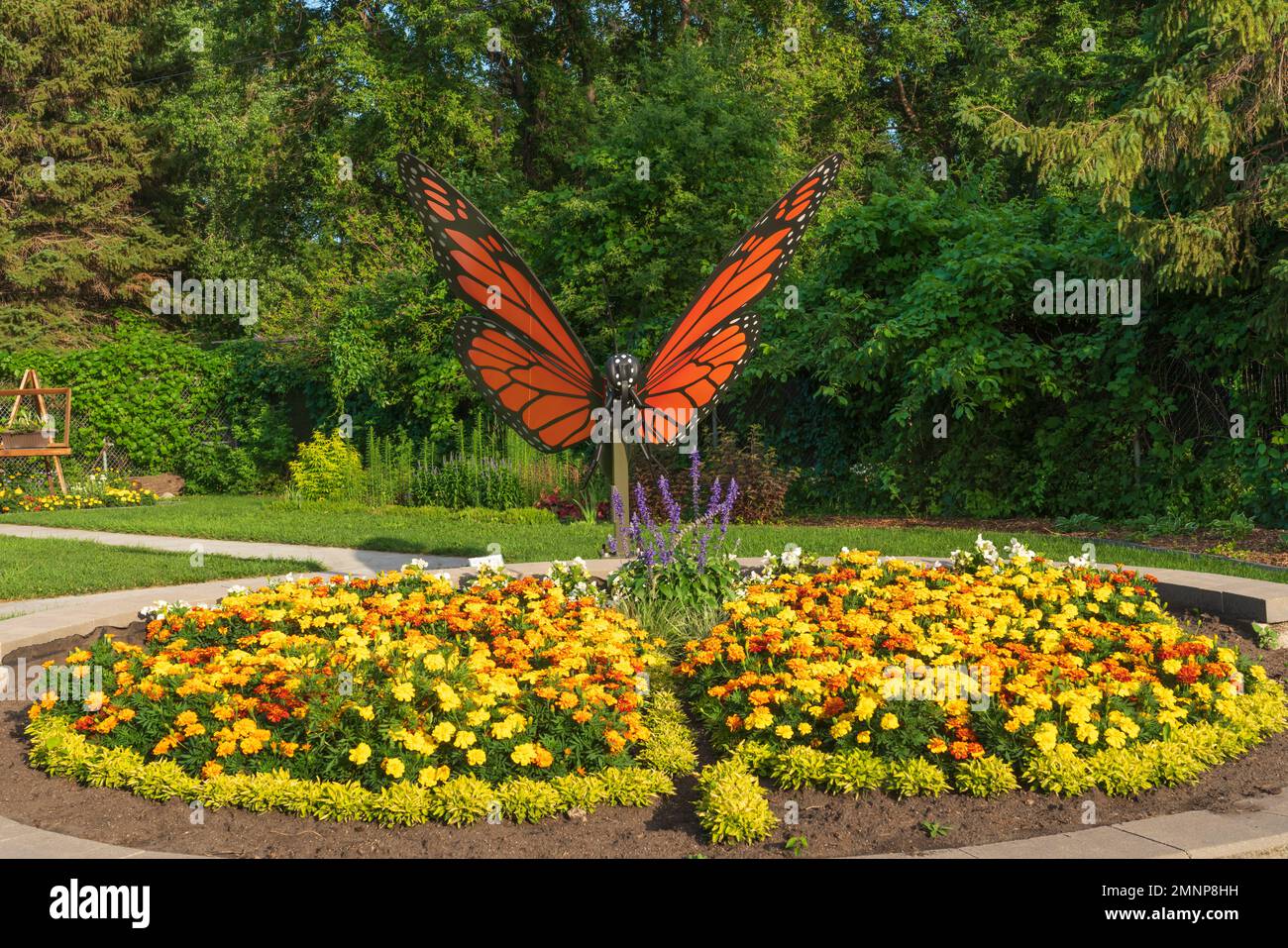 A flower garden and butterfly sculpture at the Butterfly Gardens near