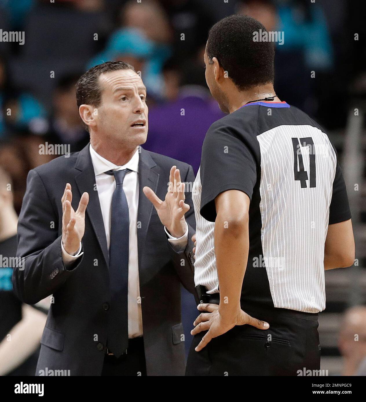 Brooklyn Nets head coach Kenny Atkinson, left, argues a call with