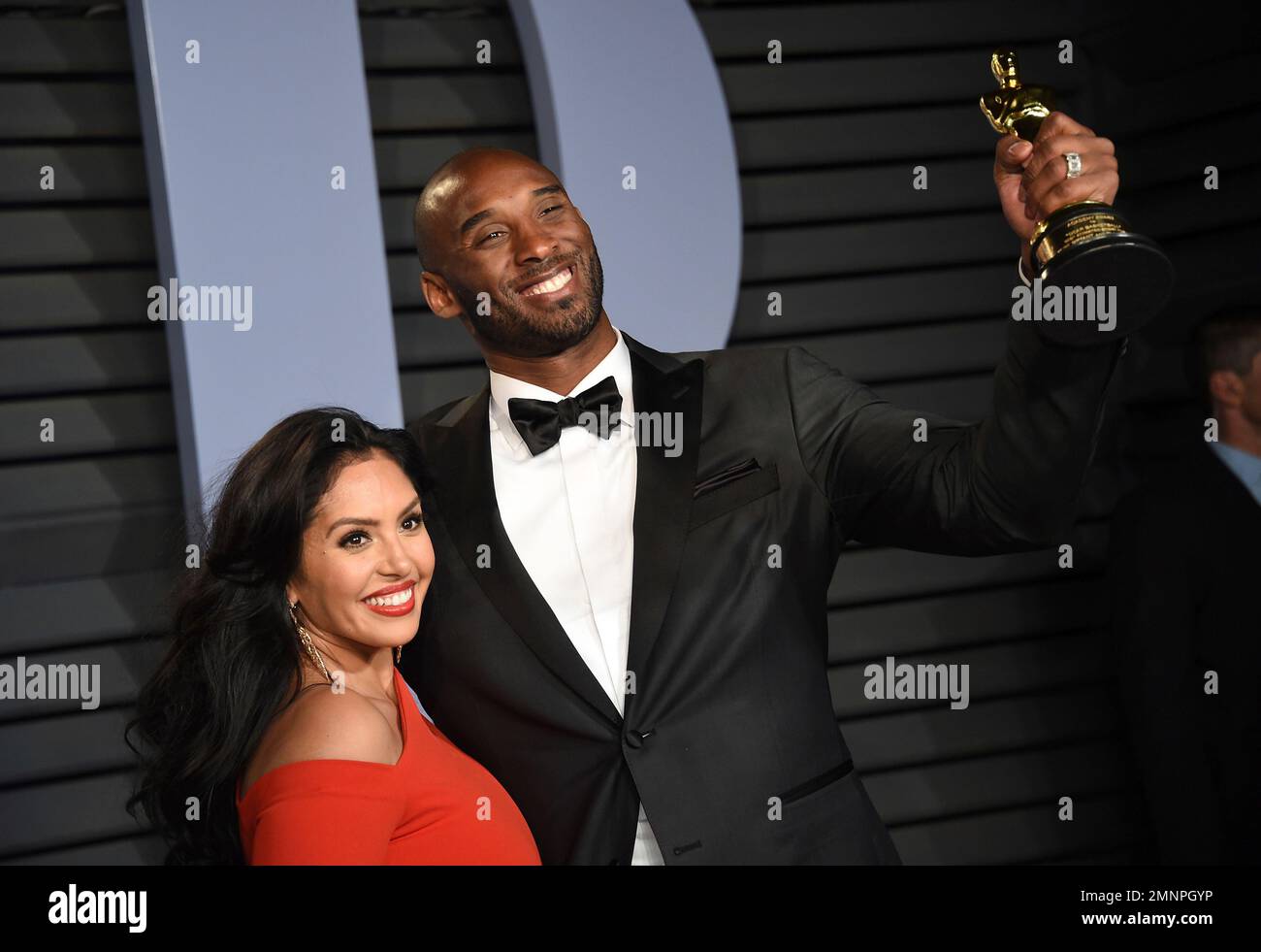 Kobe Bryant, right, winner of the Best Animated Short Film award for 'Dear Basketball and wife