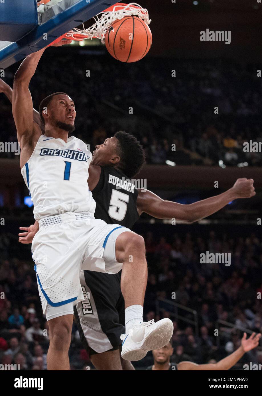 Creighton guard Davion Mintz (1) dunks past Providence forward Rodney
