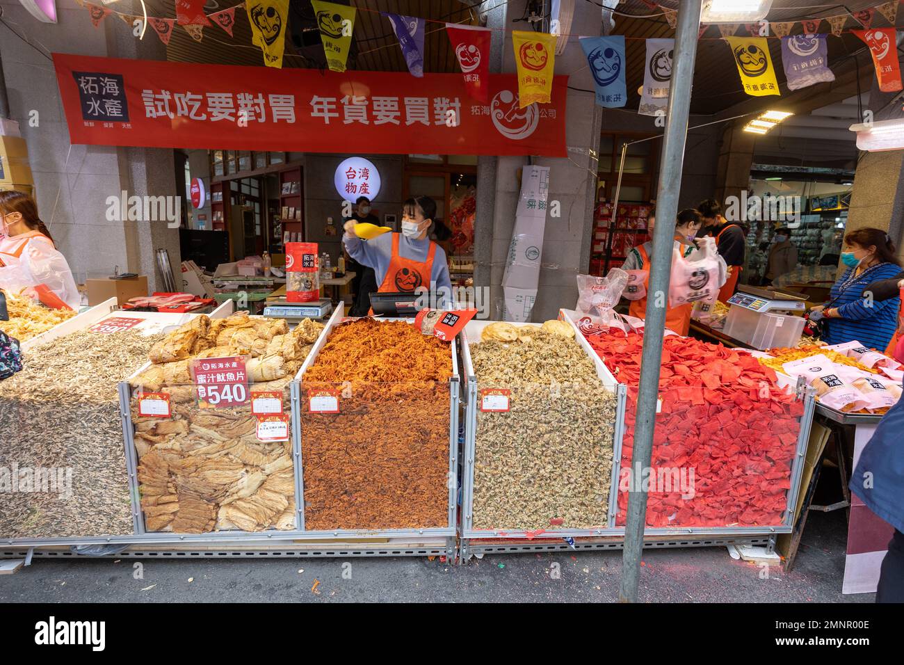 Stall at Dihua St New Year market in Taipei selling traditional snacks. Stock Photo