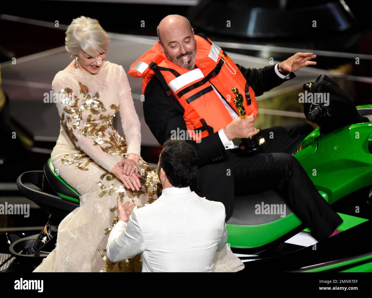 Helen Mirren, left, talks with host Jimmy Kimmel while sitting with
