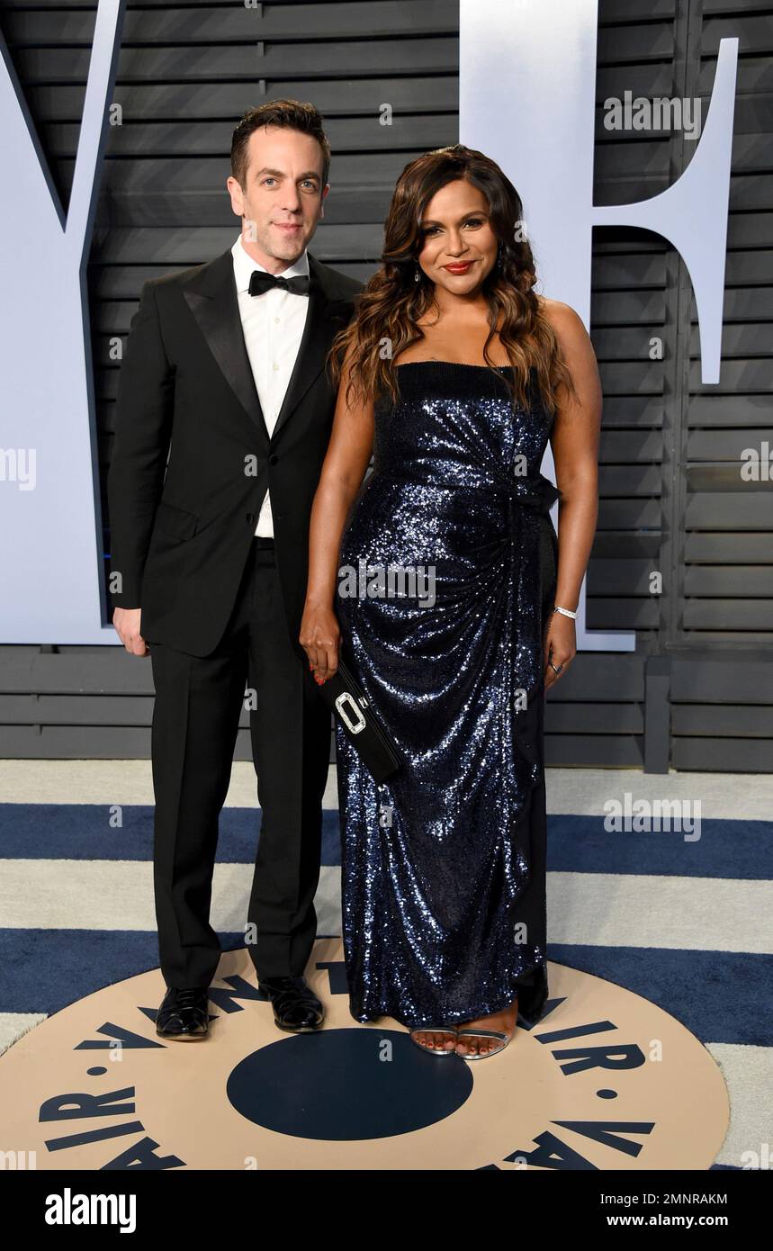 B.J. Novak, left, and Mindy Kaling arrive at the Vanity Fair Oscar