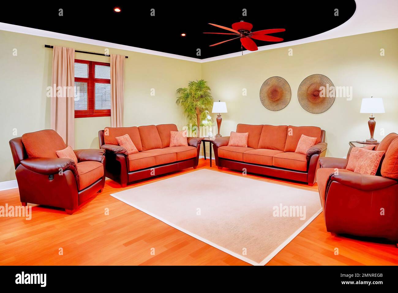 Artificial living area with armchairs, couch and carpet under a fan on the black ceiling, made with generative AI Stock Photo
