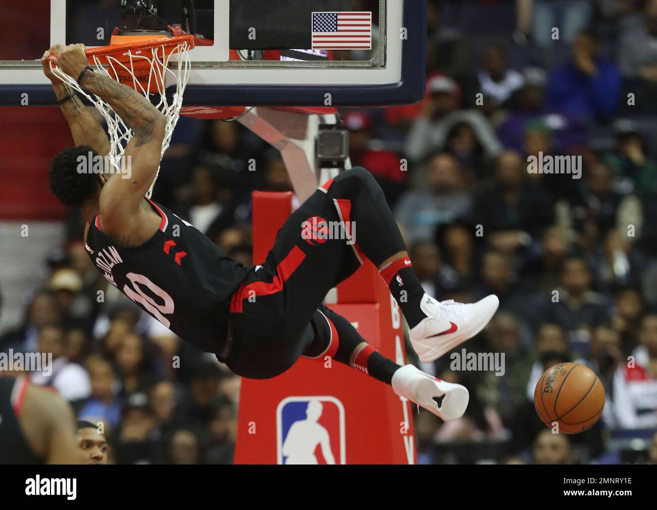 Toronto Raptors guard DeMar DeRozan 10 hangs ofrom the rim after