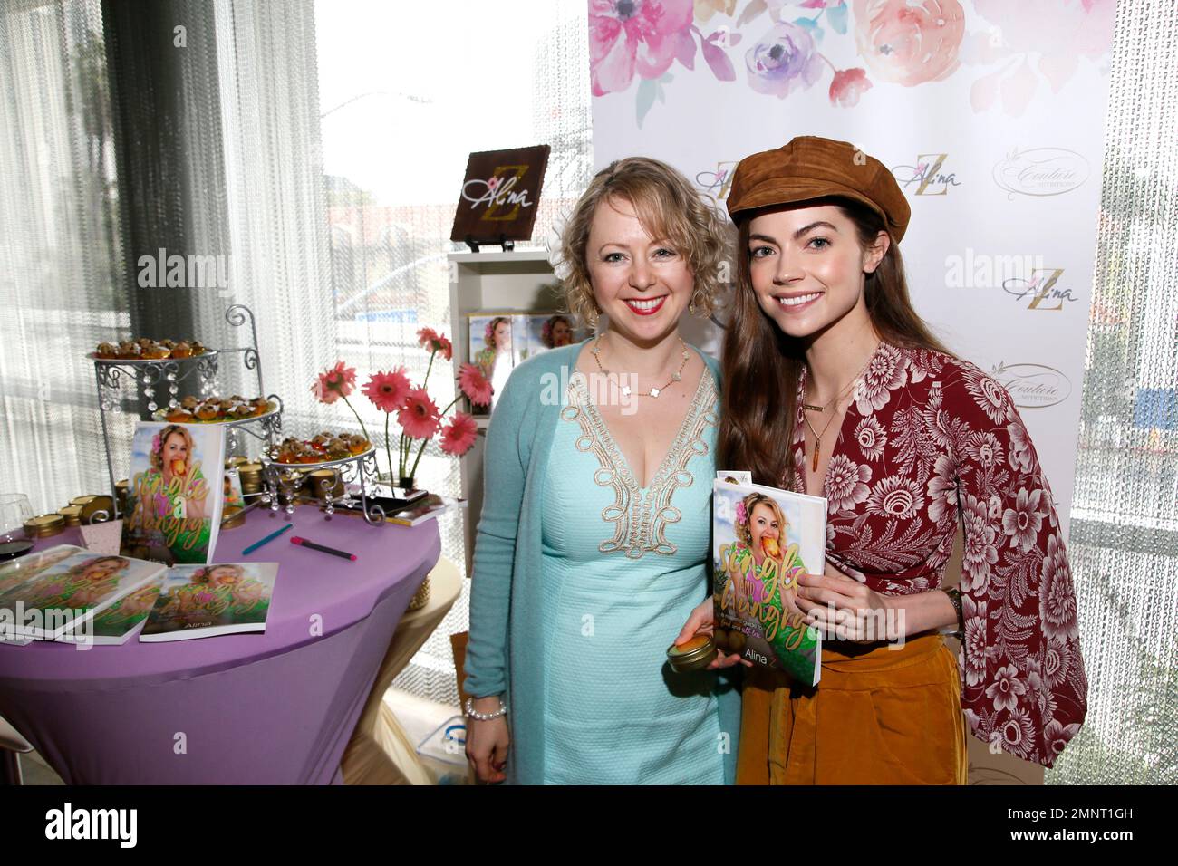 Caitlin Carver, right, poses with Chef Alina Z at Day 2 of the Kari
