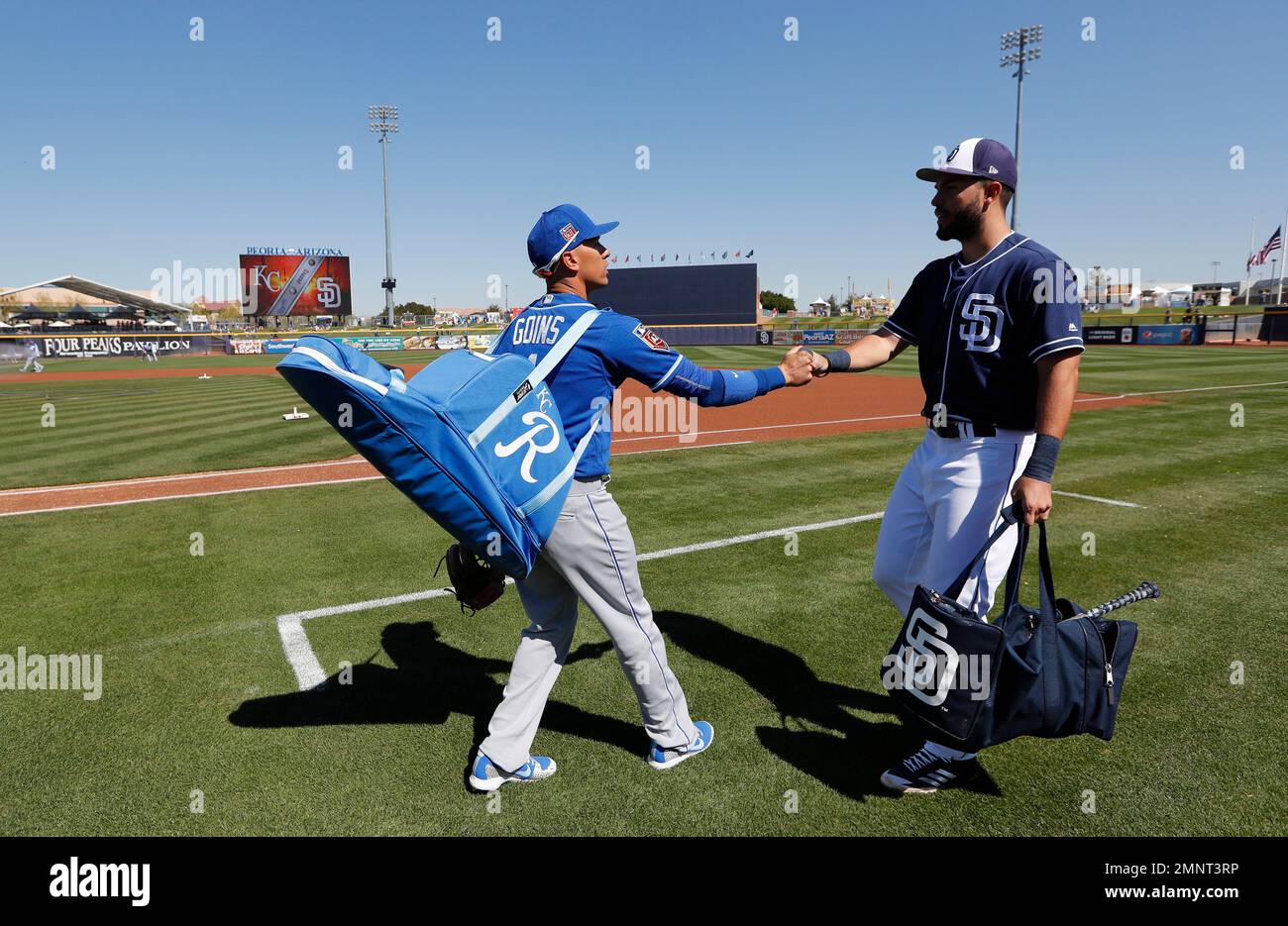 Kansas City Royals' Ryan Goins, left, greets San Diego Padres' Eric Hosmer  before a spring training baseball game, Friday, March 2, 2018, in Peoria,  Ariz. (AP Photo/Charlie Neibergall Stock Photo - Alamy