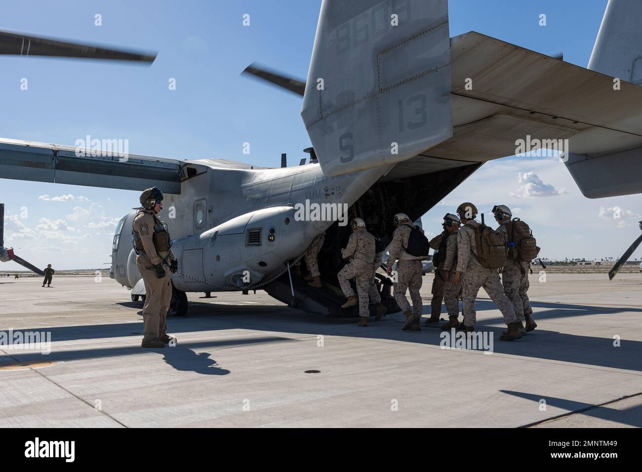 U.S. Marines assigned to Marine Aviation Weapons and Tactics Squadron One (MAWTS-1) embark an MV-22B Osprey during Weapons and Tactics Instructors (WTI) course 1-23 at Marine Corps Air Station Yuma, Arizona, Oct. 5, 2022. WTI is a seven-week training event hosted by MAWTS-1, providing standardized advanced tactical training and certification of unit instructor qualifications to support Marine aviation training and readiness, and assists in developing and employing aviation weapons and tactics. Stock Photo