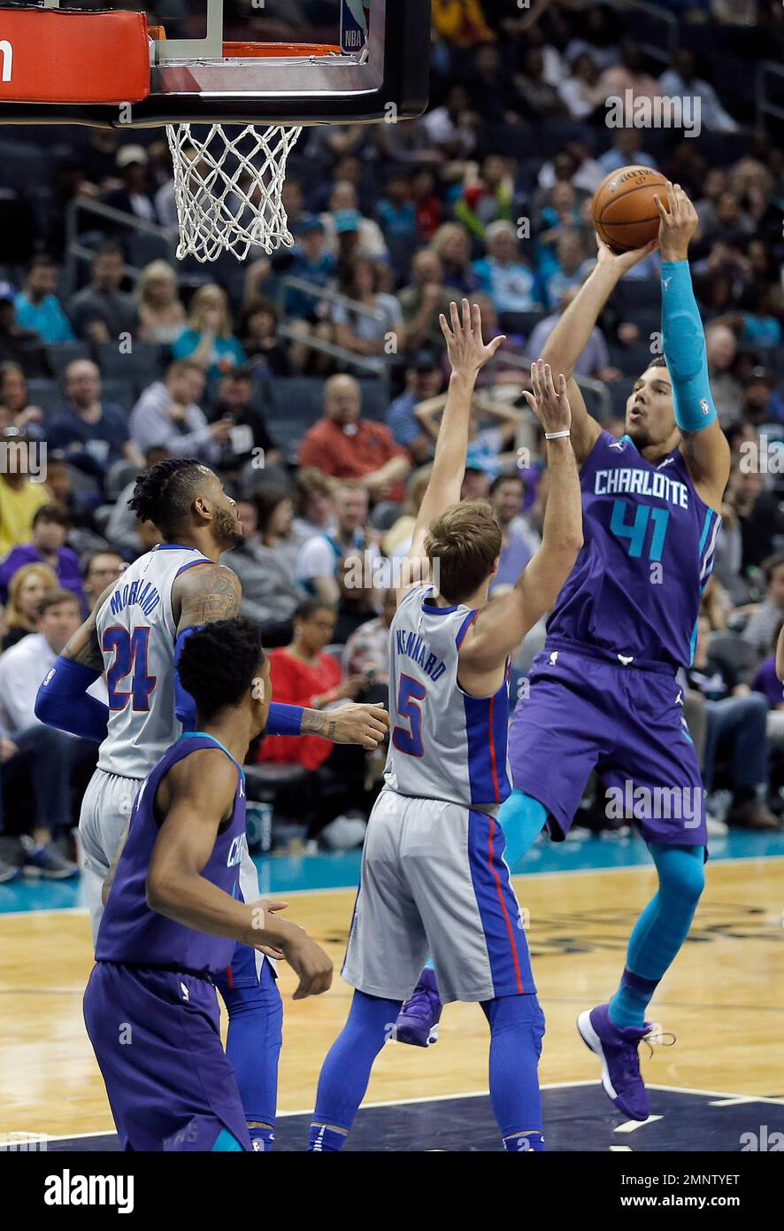 Charlotte Willy Hernangomez (41) aims a shot over Detroit