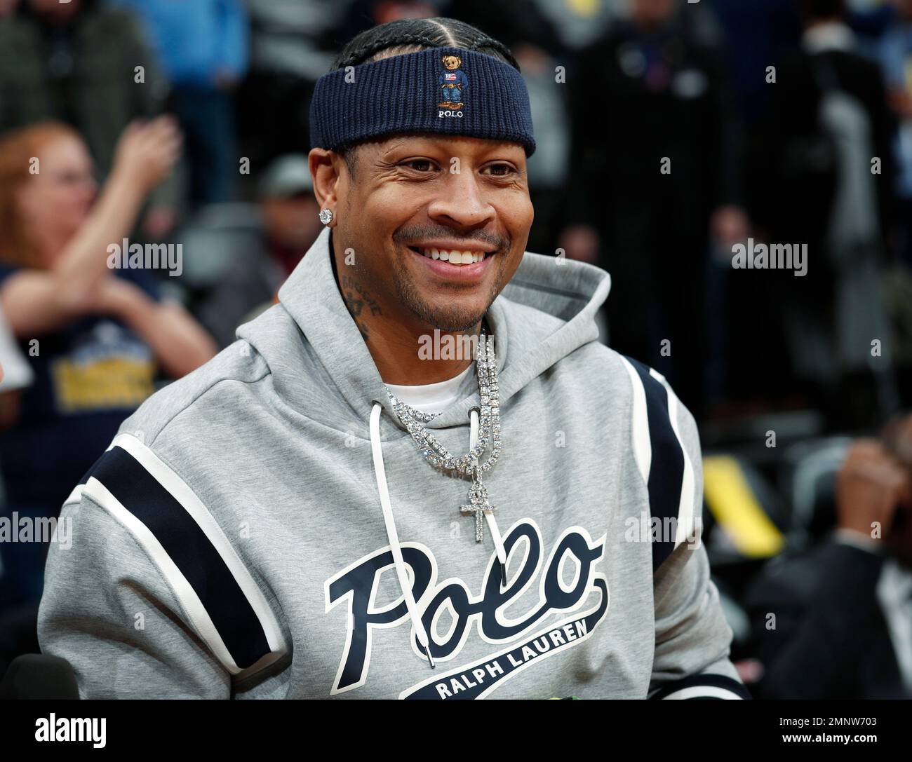 Retired Denver Nuggets guard Allen Iverson smiles as he jokes with fans  before taking a seat to watch the Nuggets play the San Antonio Spurs in an  NBA basketball game Friday, Feb.