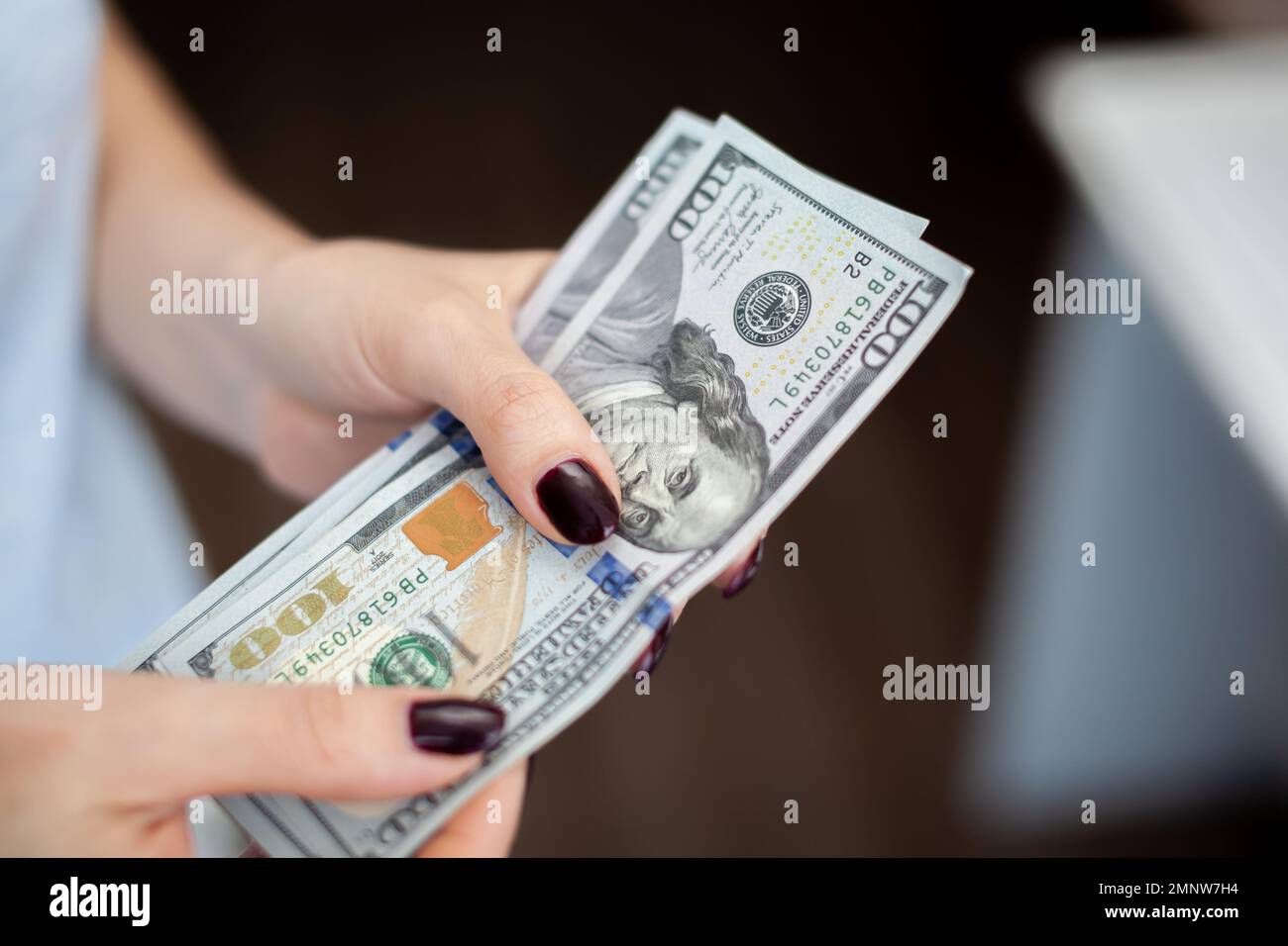 Close up female hand Counting and holding money us dollar. The concept of financial business and crisis. Stock Photo