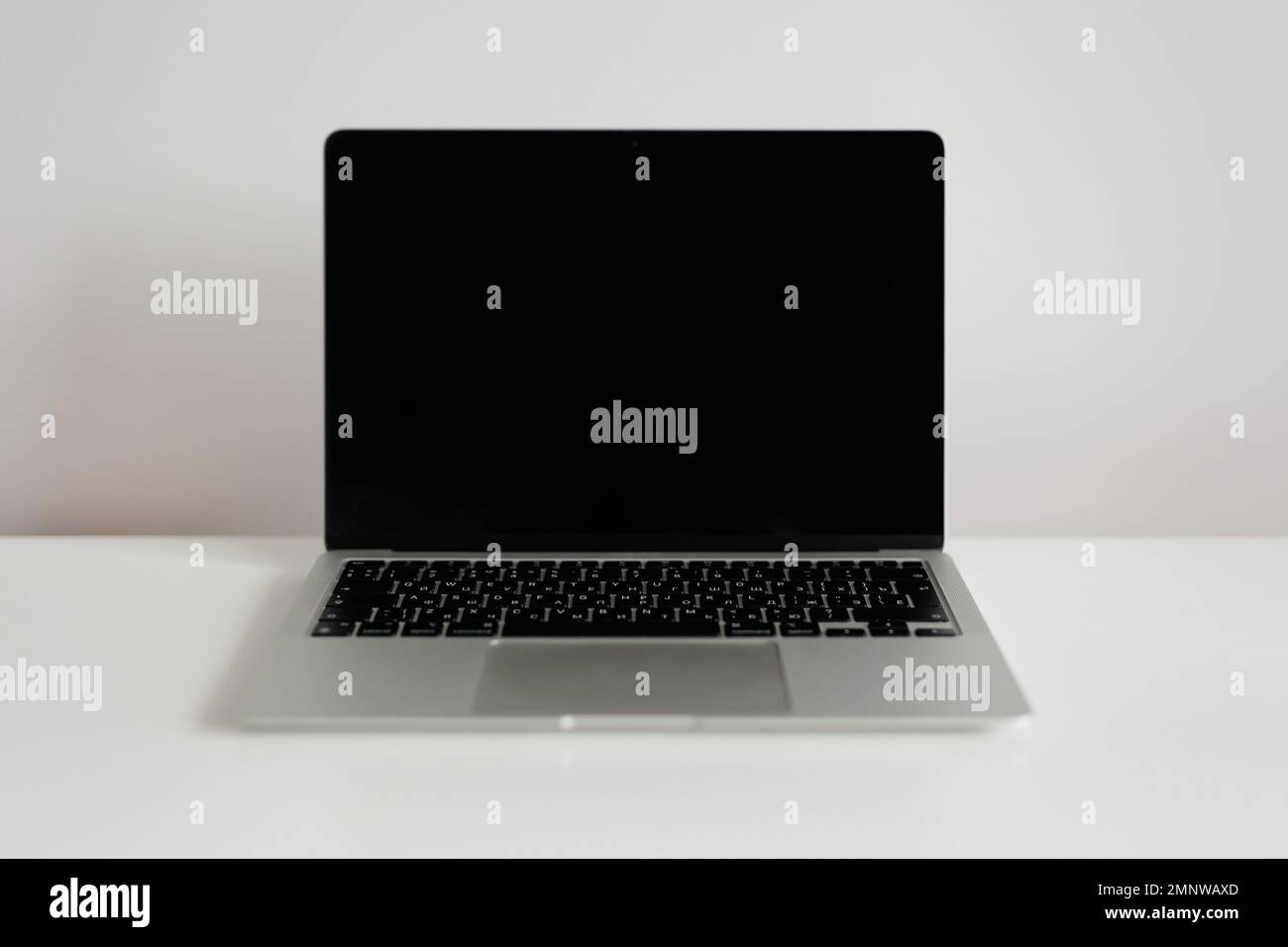 Modern laptop with blank screen on white table Stock Photo - Alamy