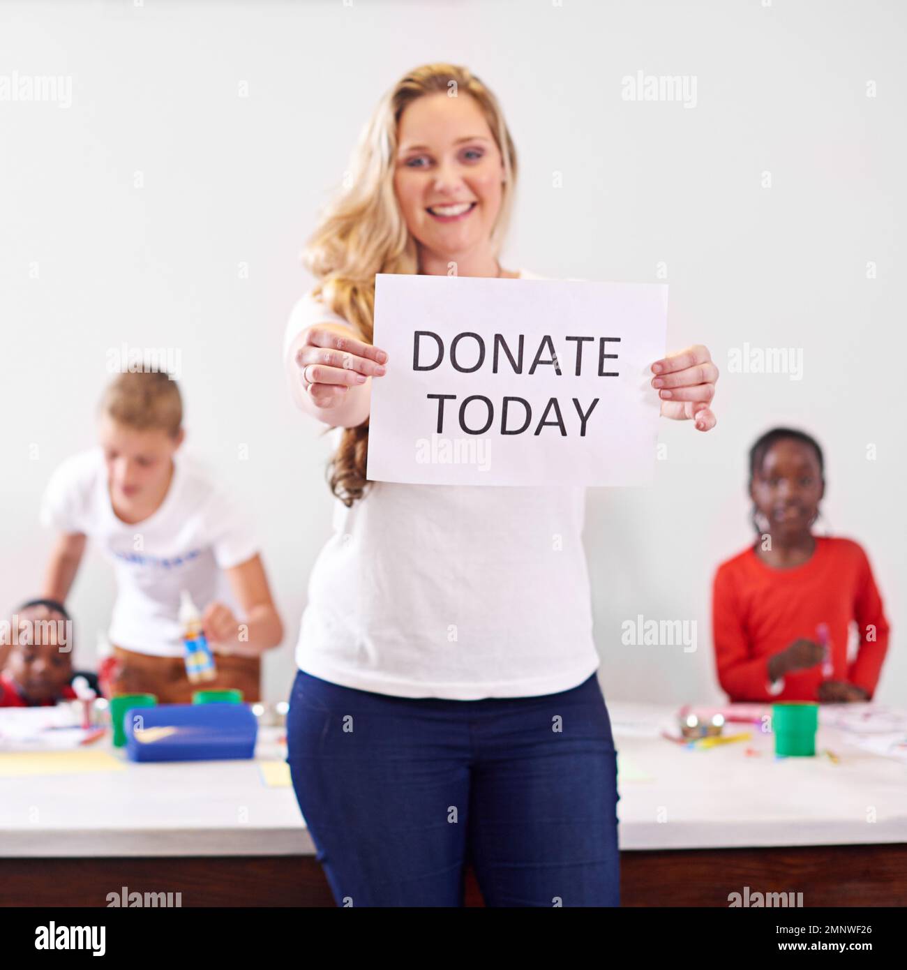 Hand Holding Please Donate Sign Stock Photo 191669165